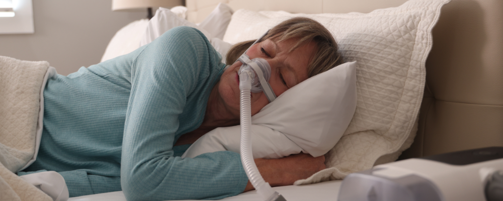 Woman Sleeping On Side With CPAP Mask