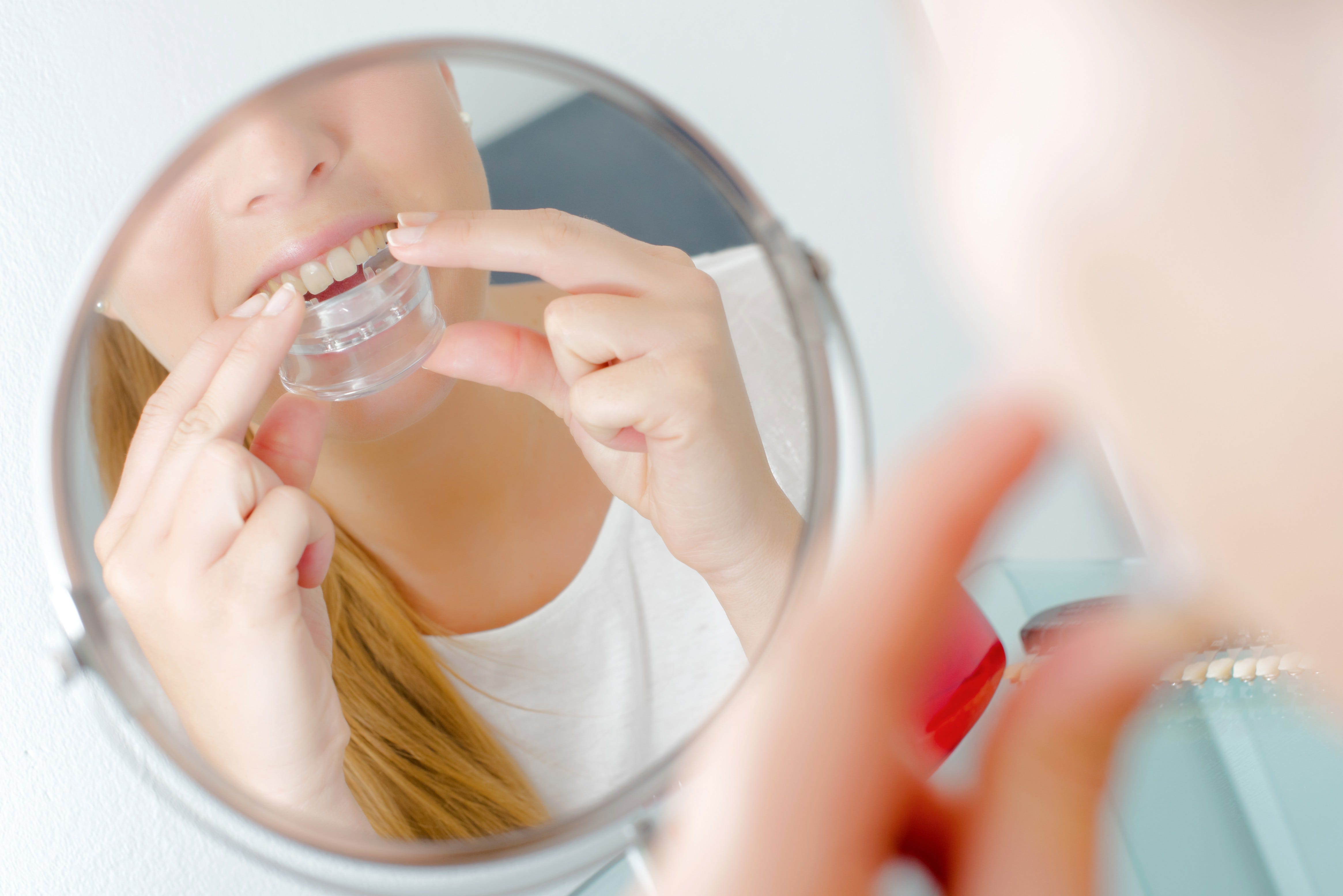 Woman Placing Mouth Guard 1  